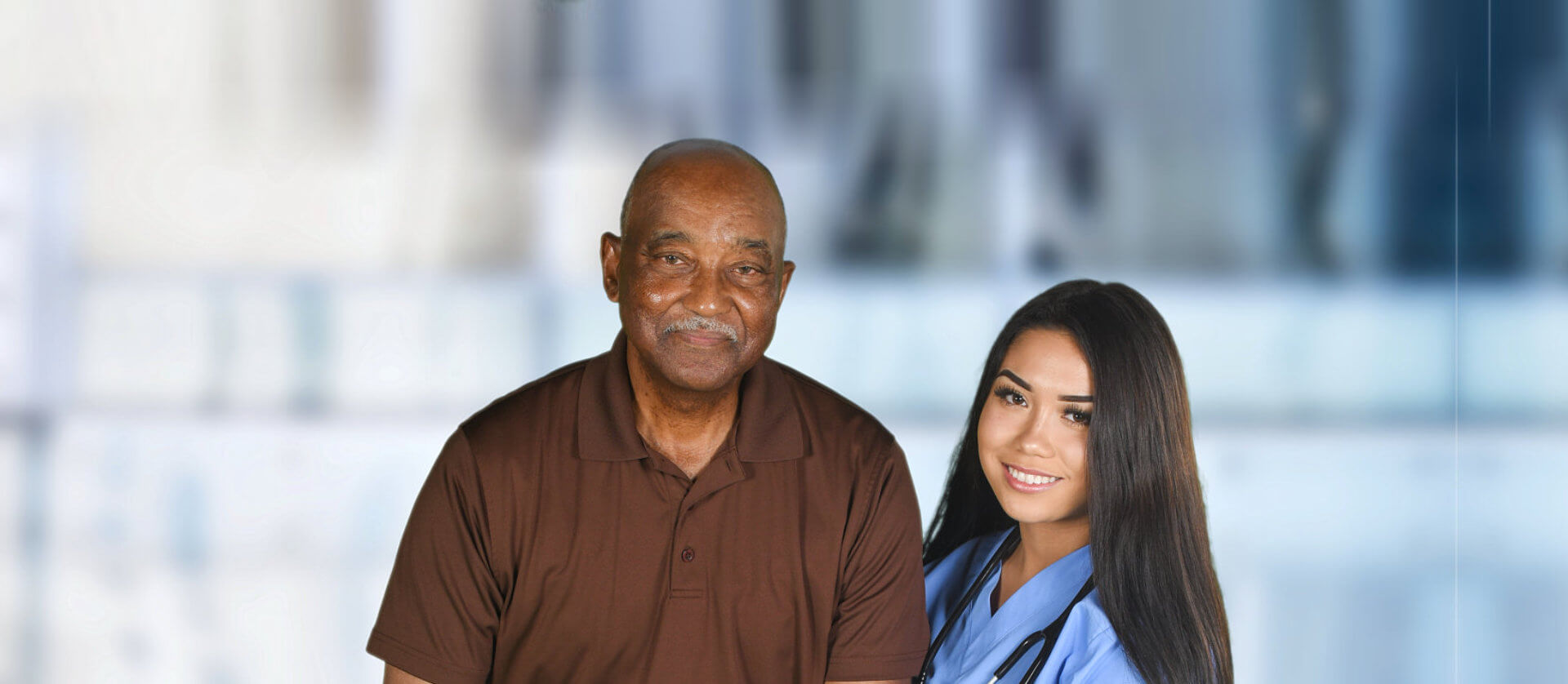 senior man and caregiver smiling